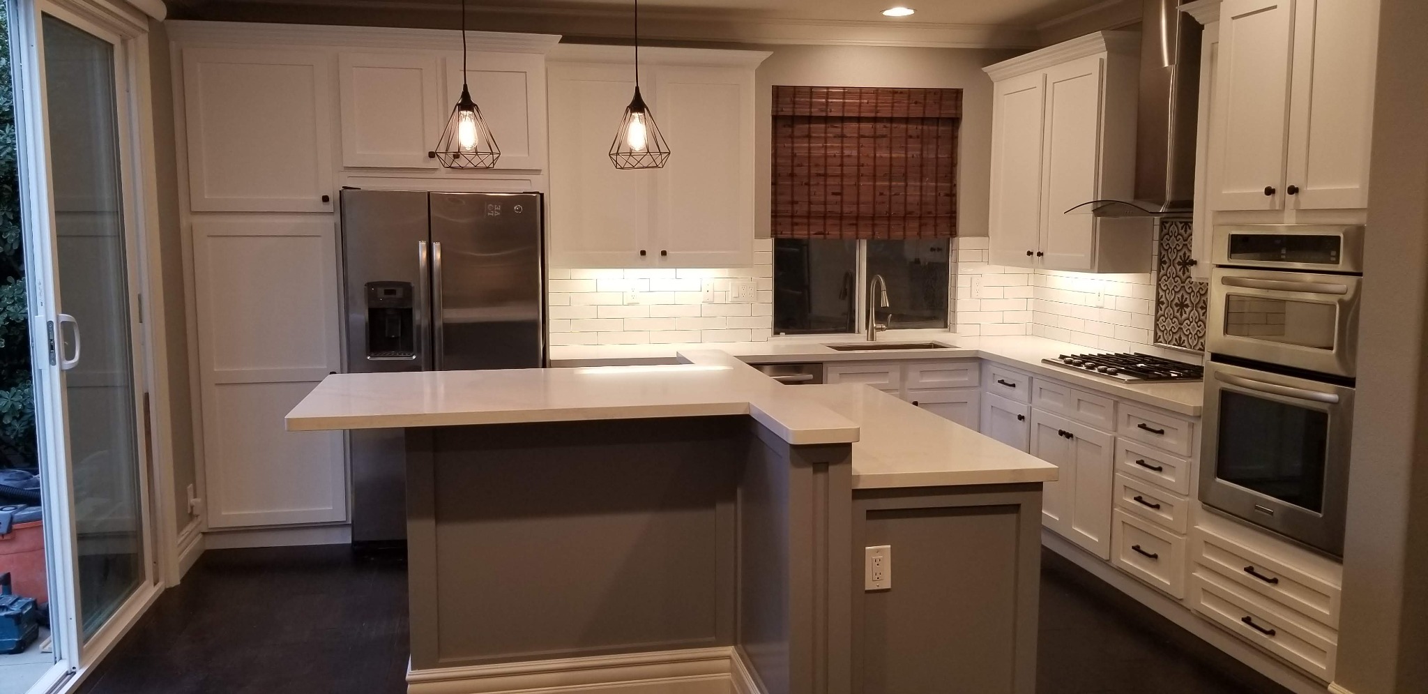 Transitional kitchen remodel with peninsula and shaker cabinets